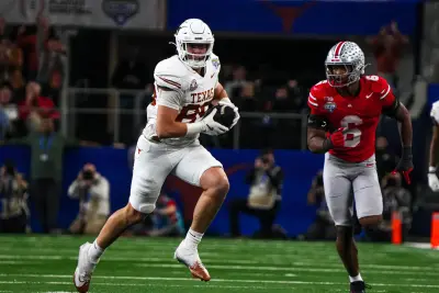 Texas Longhorns tight end Gunnar Helm (85) runs the ball during the College Football Playoff semifinal game against Ohio State in the Cotton Bowl at AT&T Stadium on Friday, Jan. 10, 2024 in Arlington, Texas.