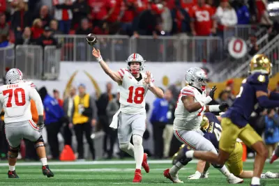 Jan 20, 2025; Atlanta, GA, USA; Ohio State Buckeyes quarterback Will Howard (18) passes the ball against the Notre Dame Fighting Irish during the first half the CFP National Championship college football game at Mercedes-Benz Stadium.