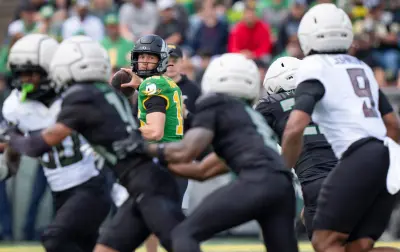 Fighting Ducks quarterback Austin Novosad looks to pass as the Fighting Ducks face off against Mighty Oregon in the Oregon Ducks spring game on April 26, 2025, at Autzen Stadium in Eugene.