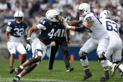 Apr 26, 2025; University Park, PA, USA; Penn State Nittany Lions offensive linesman Jim Fitzgerald (65) blocks defensive end Jaylen Harvey during the second quarter of the Blue White spring game at Beaver Stadium. The White team defeated the Blue team 10-8. Mandatory Credit: Matthew O'Haren-Imagn Images