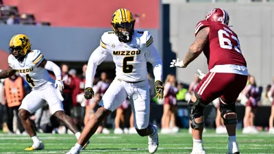 Five-star defensive lineman prospect Williams Nwaneri dons a University of Missouri hat to officially commit to MU on August 14