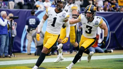 Iowa defensive back Xavier Nwankpa (1) celebrates his touchdown with Cooper DeJean (3) against Kentucky during the second quarter of the TransPerfect Music City Bowl