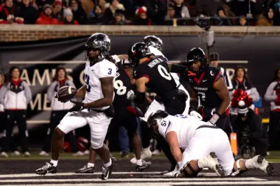 Nov 30, 2024; Cincinnati, Ohio, USA; TCU Horned Frogs wide receiver Savion Williams (3) scores a touchdown against the Cincinnati Bearcats in the first quarter at Nippert Stadium.