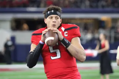 Nov 25, 2016; Arlington, TX, USA; Texas Tech Red Raiders quarterback Patrick Mahomes (5) warms up on the bench during the game against the Baylor Bears at AT&T Stadium. Texas Tech defeated Baylor 54-35. Mandatory Credit: Michael C. Johnson-Imagn Images