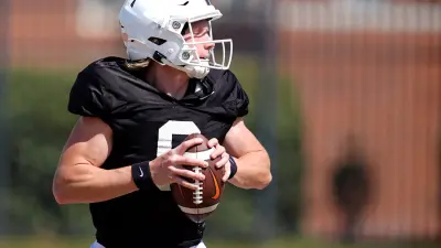 Oklahoma State's Zane Flores looks to throw the ball during a Spring football practice at Oklahoma State University in Stillwater