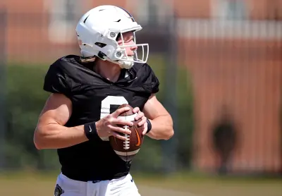 Oklahoma State's Zane Flores looks to throw the ball during a Spring football practice at Oklahoma State University in Stillwater, Okla., Tuesday, April, 8, 2025.