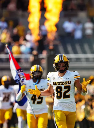 Sep 17, 2022; Columbia, Missouri, USA; Missouri Tigers wide receiver Logan Muckey (82) and defensive lineman DJ Wesolak (45) take the field before a game against the Abilene Christian Wildcats at Faurot Field at Memorial Stadium. Mandatory Credit: Jay Biggerstaff-Imagn Images