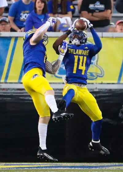 Delaware defensive back KT Seay snares an interception deep in Delaware territory in front of fellow defensive back Ty Davis in the second quarter against Saint Francis at Delaware Stadium, Saturday Sept. 16, 2023. © William Bretzger-Delaware News Journal / USA TODAY NETWORK