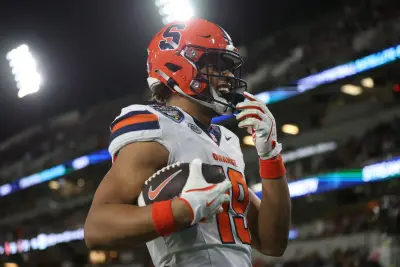 Dec 27, 2024; San Diego, CA, USA; Syracuse Orange tight end Oronde Gadsden II (19) scores a touchdown against the Washington State Cougars during the second quarter at Snapdragon Stadium.